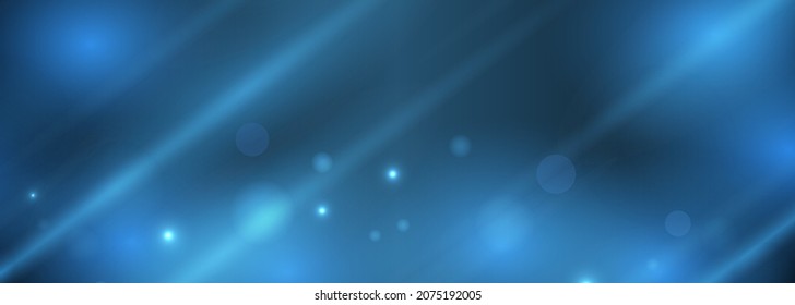 Abstract blue festive background with bokeh light effect on wide banner. Holiday glowing blue lights with sparkles. Festive defocused lights. Blurred bright abstract bokeh on blue background.