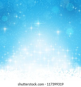 Abstract blue festive background with out of focus light dots, stars and snowflakes. Great for the festive season of Christmas or any winter theme.