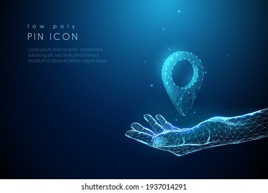 Abstract blue giving hand holds pin icon. Low poly style design. Navigation concept. Modern 3d graphic geometric background. Wireframe light connection structure. Isolated vector illustration.