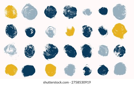 Abstract blue and gold ink circles set on white background. Brushstroke rings with filled and unfilled shapes. Grunge artistic textures, modern paint elements, expressive circular design composition.