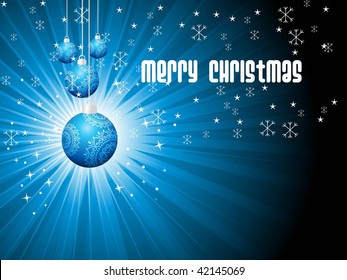 abstract blue rays background with hanging decorated xmas ball