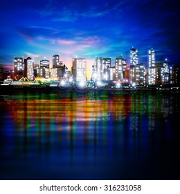 abstract blue sky background with panorama of illuminated city by night