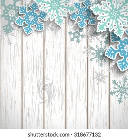 Abstract blue snowflakes with 3d effect on white wooden background, winter or christmas concept, vector illustration, eps 10 with transparency