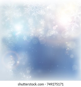 Abstract blue white background with snow flakes, blurry light dots, light effect background with copy space  for the coming winter and Christmas season.