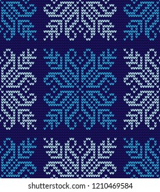 Abstract blue and white seamless knitting pattern with snowflakes background