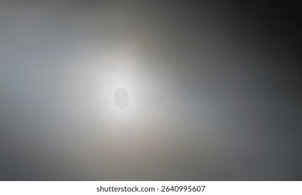 Abstract blur background with bright center light, neutral gray soft gradient texture, glowing smooth wallpape