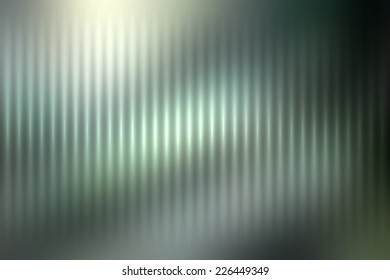 Abstract blur colored background with defocused vertical rays of light.