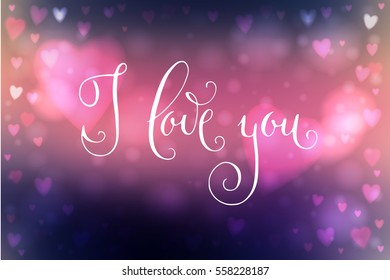 Abstract blur pink and blue background with heart-shaped lights over it and hand written I love you words.