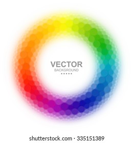 Abstract blurry dotted color wheel on white background.