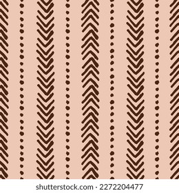 Abstract bohemian seamless repeat pattern. Vertical, hand drawn, vector arrows with dots all over surface print on beige background.