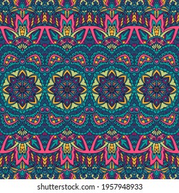 Abstract boho bright festive pattern for fabric. Geometric doodle colorful seamless pattern ornamental.