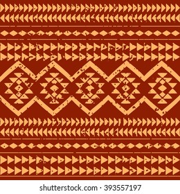 Abstract boho style seamless pattern with grunge effect. Aztec hand drawn wallpaper.
