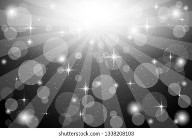 Abstract bokeh background. Festive defocused lights. Star burst with sparkles on black background.