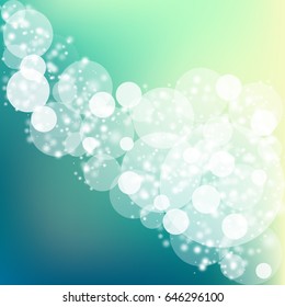 Abstract bokeh sparkles on blue blurred background
