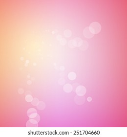 Abstract bokeh sparkles on pink blurred background.