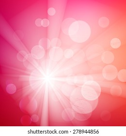 Abstract bokeh sparkles on pink blurred background