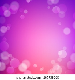 Abstract bokeh sparkles on purple blurred background