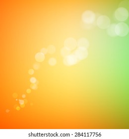 Abstract bokeh sparkles on yellow blurred background