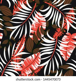 Abstract bright seamless background with colorful tropical leaves and flowers on dark background. Vector design. Jungle print. Floral background. Printing and textiles. Exotic tropics. Fresh design.