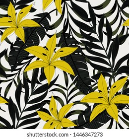 Abstract bright seamless background with colorful tropical leaves and flowers on white background. Vector design. Jungle print. Floral background. Printing and textiles. Exotic tropics. Fresh design.
