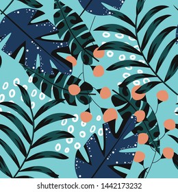 Abstract bright seamless pattern with colorful tropical leaves and plants on blue background. Vector design. Jungle print. Floral background. Printing and textiles. Exotic tropics. Fresh design.