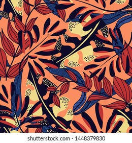 Abstract bright seamless pattern with colorful tropical leaves and plants on orange background. Vector design. Jungle print. Floral background. Printing and textiles. Exotic tropics. Fresh design.