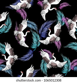 Abstract bright seamless pattern with swans and palm leaves, vector illustration