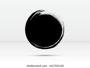 Abstract brushed black ink circle with rough edges and grungy texture. Dark inky dot