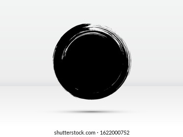 Abstract brushed black ink circle with rough edges and grungy texture. Dark inky dot