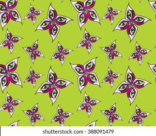 abstract butterfly monsters on a green background seamless vector pattern