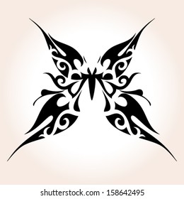 Abstract butterfly tattoo with ornamental wings. Vector image.