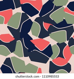 An abstract camouflage pattern containing uneven spots of different colors. Fashionable texture.