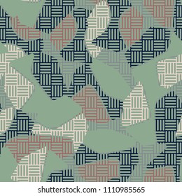 An abstract camouflage pattern containing uneven spots of different colors. Fashionable texture. A network of striped squares consisting of their perpendicular segments.