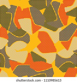 An abstract camouflage pattern containing uneven spots of different colors. Fashionable texture. A network of small mutually perpendicular ovals.