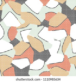 An abstract camouflage pattern containing uneven spots of different colors. Fashionable texture. A network of small mutually perpendicular ovals.