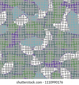 An abstract camouflage pattern containing uneven spots of different colors. Fashionable texture. Chess network consisting of divided ovals.