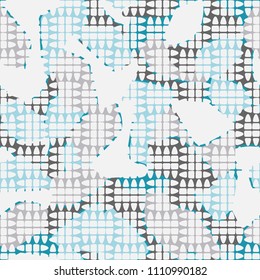 An abstract camouflage pattern containing uneven spots of different colors. Fashionable texture. Chess network consisting of divided ovals.