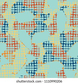 An abstract camouflage pattern containing uneven spots of different colors. Fashionable texture. Chess network consisting of divided ovals.