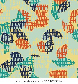 An abstract camouflage pattern containing uneven spots of different colors. Fashionable texture. A network of torn squares arranged in staggered order.
