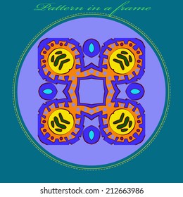 Abstract card with  circular  pattern of colored  floral motif  on a light blue circle and green  text on an azure frame. Handmade.