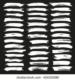 Abstract chalk grunge white vector brush strokes set on black background