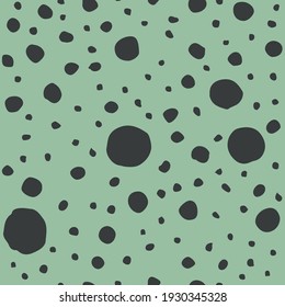 Abstract chaotic black spots, dots on green background. Moon surface. Vector illustration.