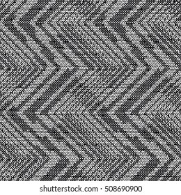 Abstract charcoal dots textured zigzag motif. Seamless pattern.