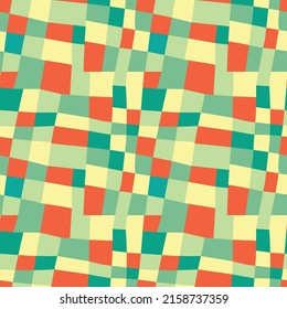 Abstract checkered pattern for fabric or background. Green-yellow tones with orange splashes.	