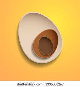 Abstract chocolate easter eggs on yellow background