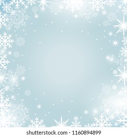 Abstract Christmas background with snowflakes and lights on blue backdrop