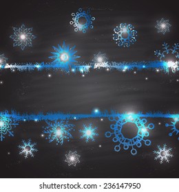  Abstract Christmas background of snowflakes shining colored chalk on a blackboard.