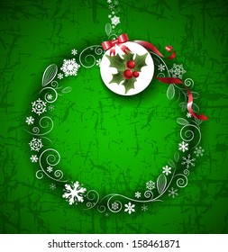Abstract Christmas ball and label from paper on green background