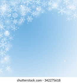 Abstract Christmas light  blue background with snowflakes.