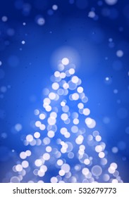 Abstract Christmas Tree by Unfocused Blurred Lights on the Vertical Blue Background 